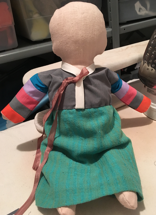an unfinished prop doll