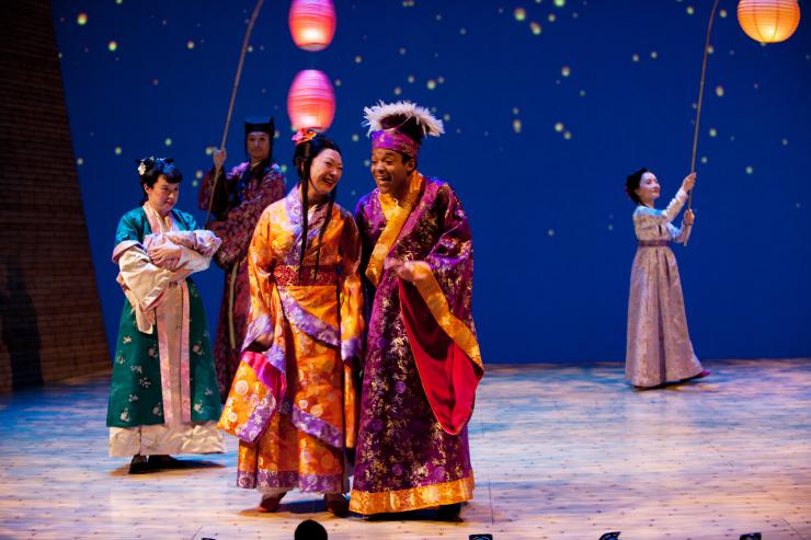 a group of women in kimonos on stage