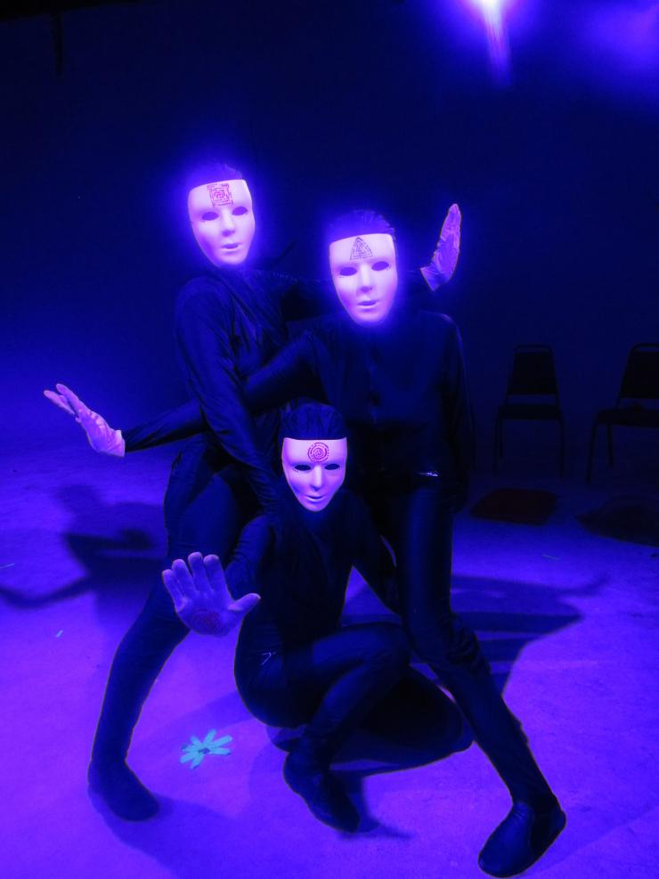 three actors in masks