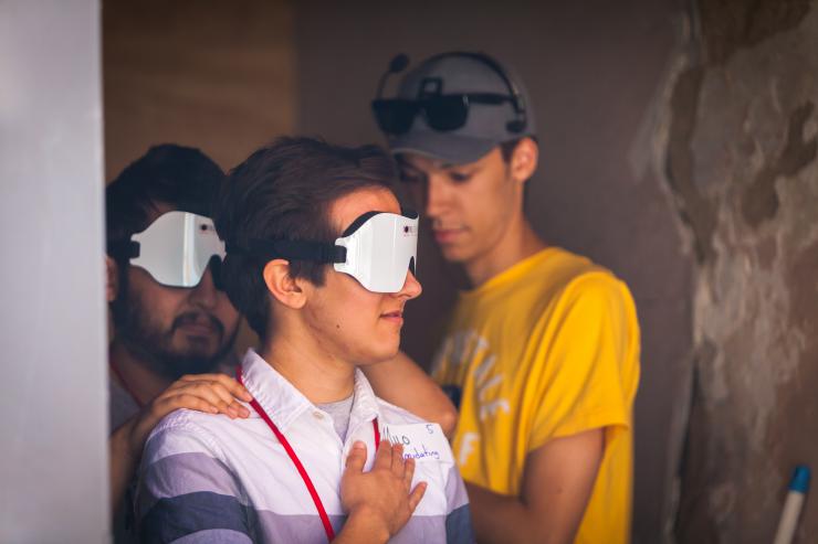 a group of people with VR goggles up