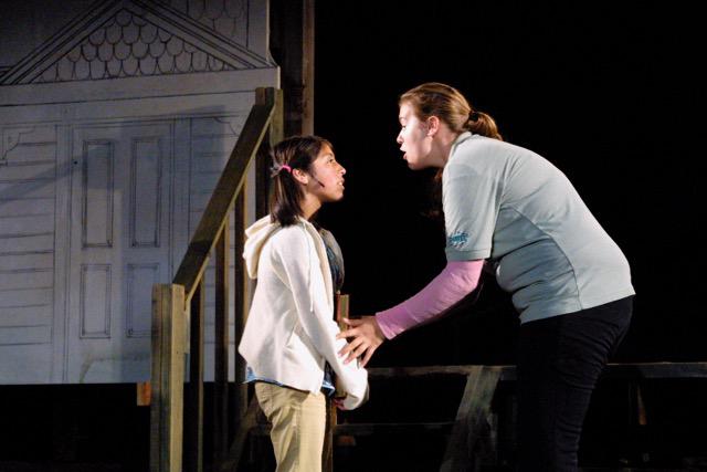 an actress and a child on stage