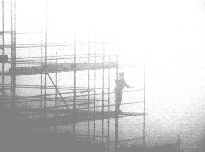 vintage photo of a man on scaffolding