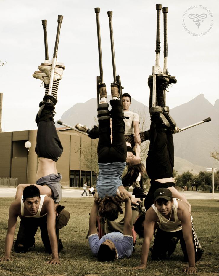 acrobats in a stunt on stilts