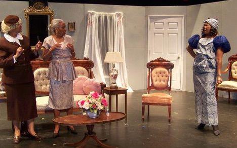 three actresses in a living room onstage