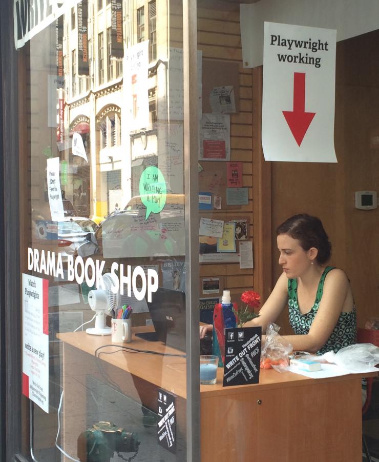 author working at a window