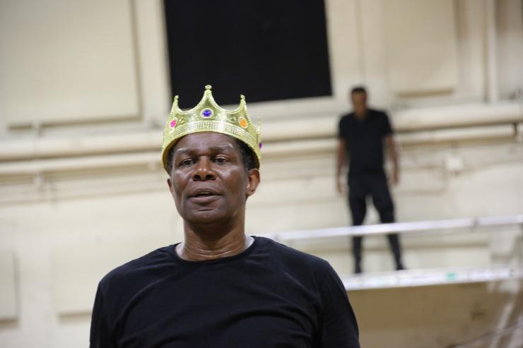 an actor wearing a crown