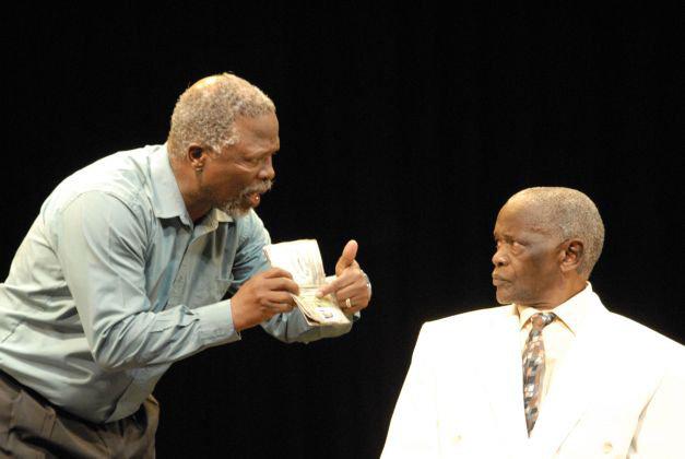 two actors arguing on stage