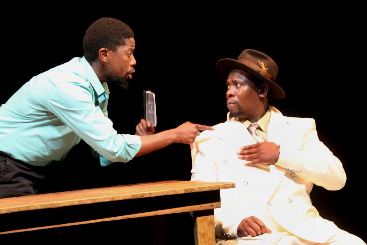 two actors arguing on stage in parallel to previous photo