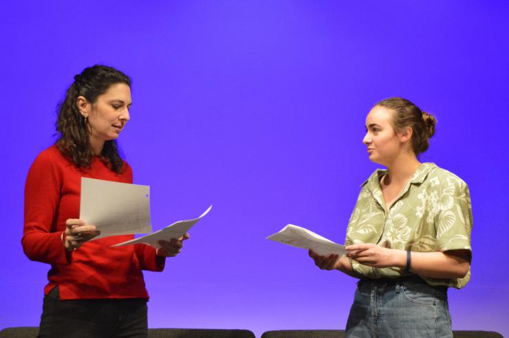 two performers in a staged reading