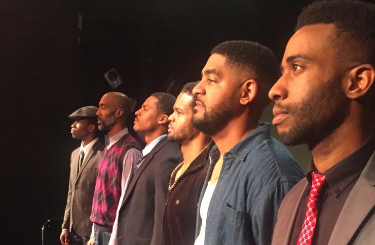 six Black actors stand in a line