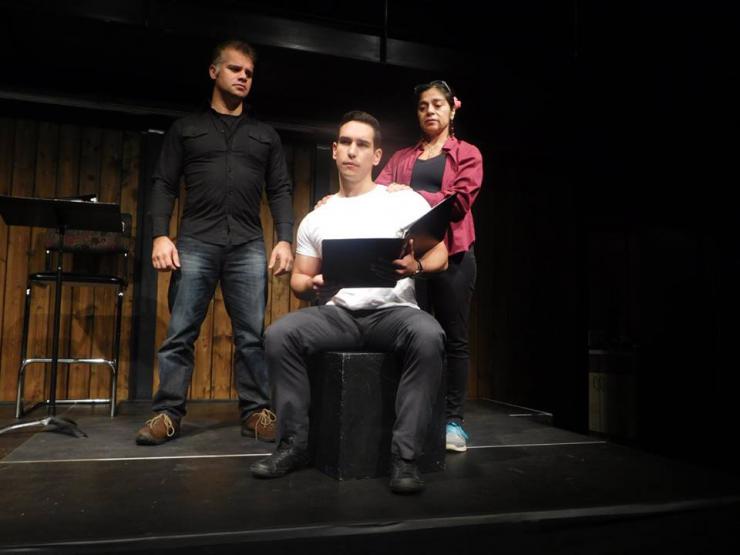 three actors in rehearsal