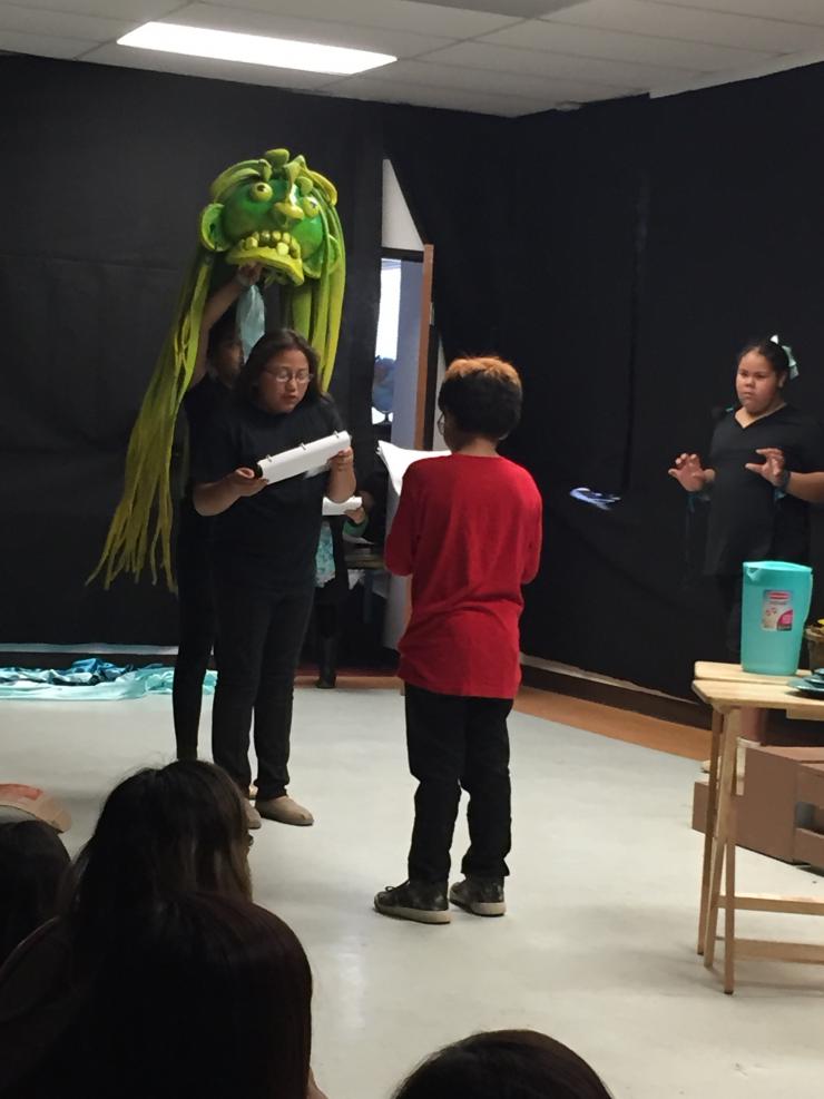 students working with a puppet