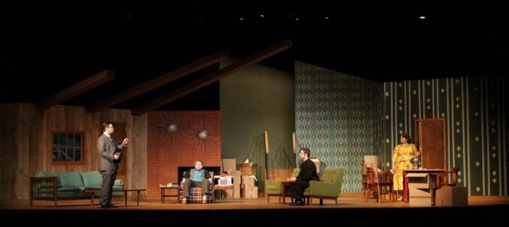 a group of actors in a living room on stage
