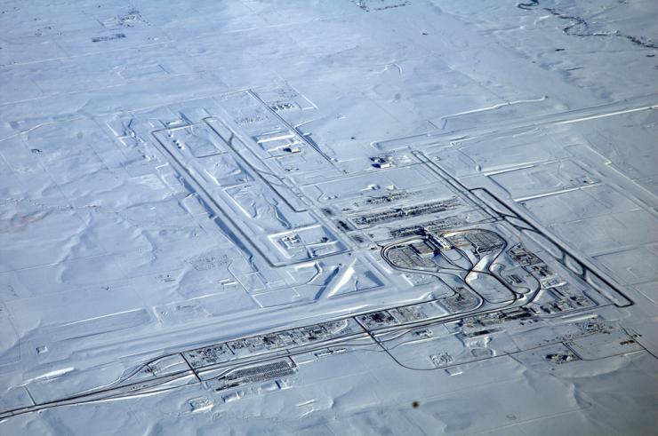 Aerial view of a snow-blanketed airport.