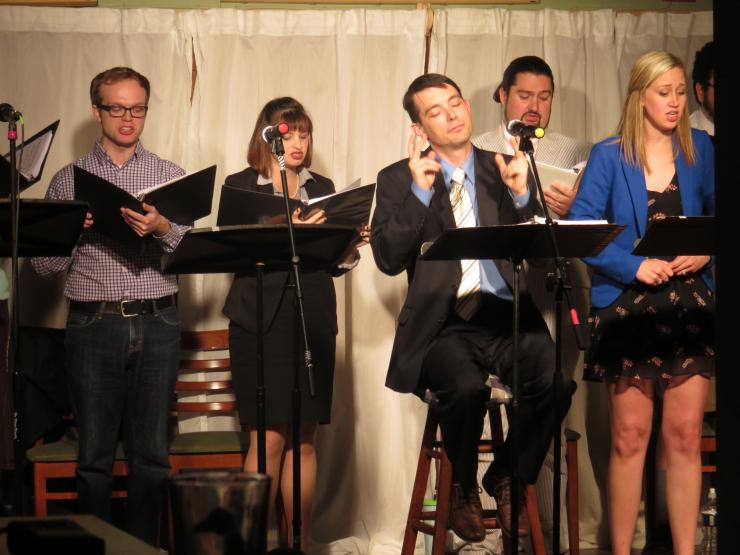 A group of singers performing at a new musicals reading