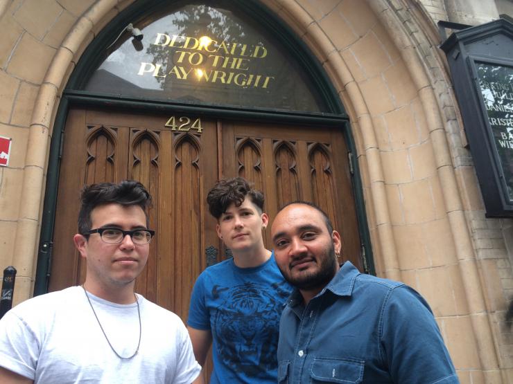 Three playwrights outside a door