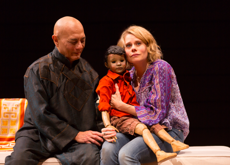 Two actors and a puppet on stage 