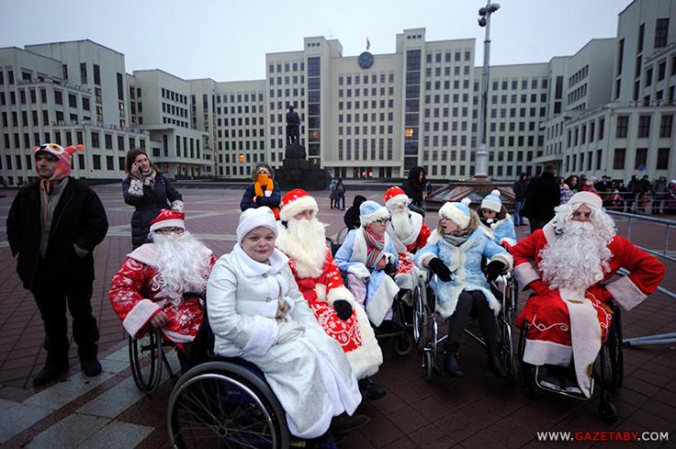 People in wheelchairs and santa costumes 