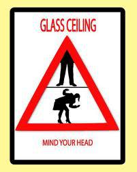 Graphic of a warning sign with a woman crouching that reads "Glass Ceiling" and "Mind Your Head".