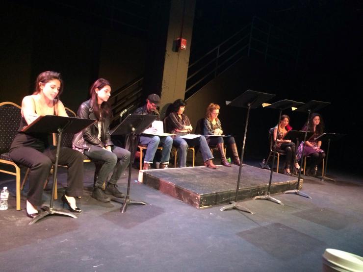 actors reading on stage 