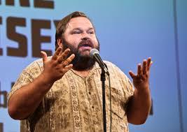 Mike Daisey on stage. 