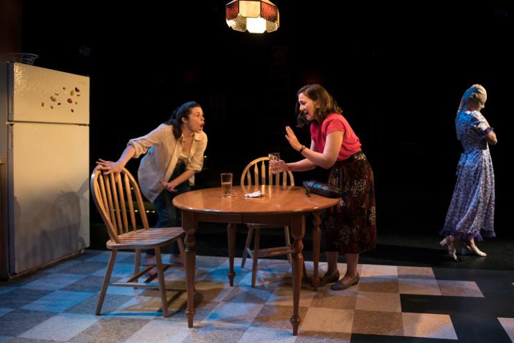 two women argue onstage