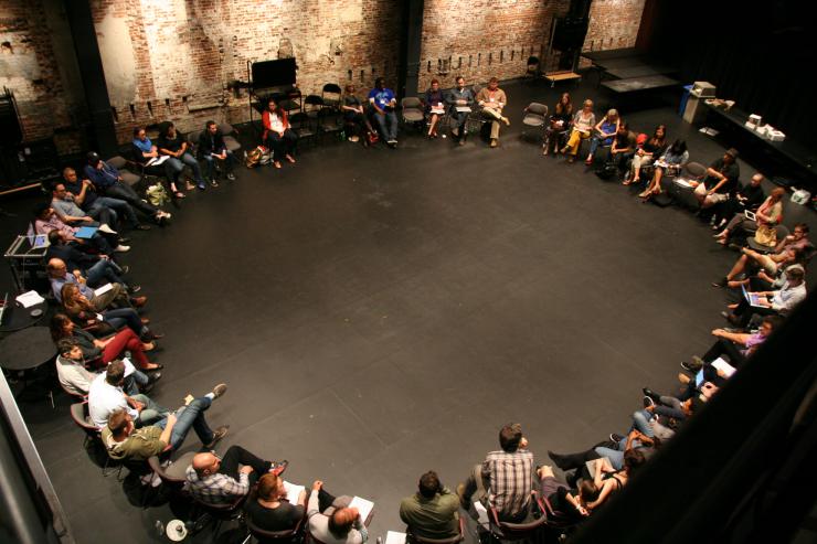 aerial view of convening participants sitting in a circle