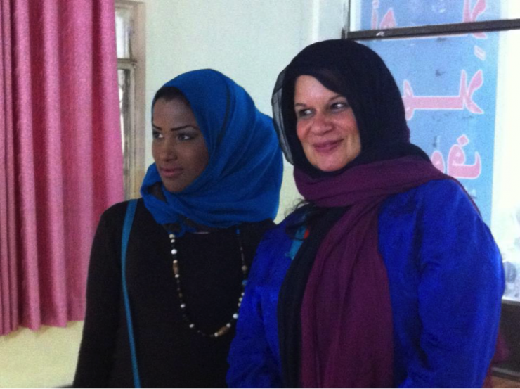 two women in hijabs smiling