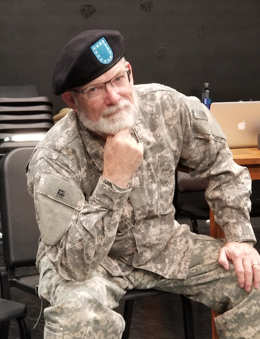 Tim Schleis sitting in uniform