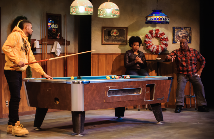 three actors playing pool