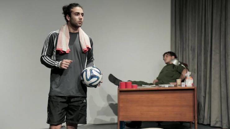 an actor holding a soccer ball