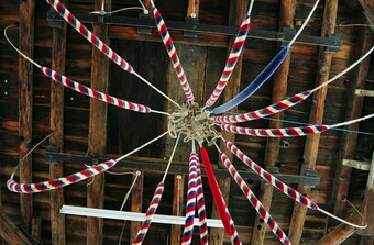 braided red, white, and blue ropes from rafters.