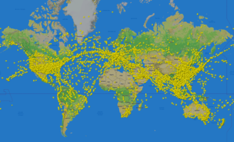 Thousands of airplane icons covering the continents and oceans on a 2-D map of the world.