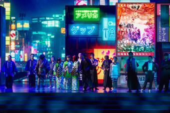 actors in traditional japanese dress against neon tokyo background
