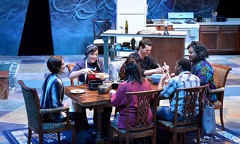 A family sits around a table in a production photo from Food and Fadwa.