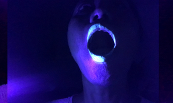 event poster for performingbordersLIVE featuring an open mouth in a dark purple light.