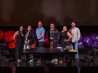 The Author and their collaborators stand on stage during the Lantinx Theatre Commons Designer and Director Colaboratorio.