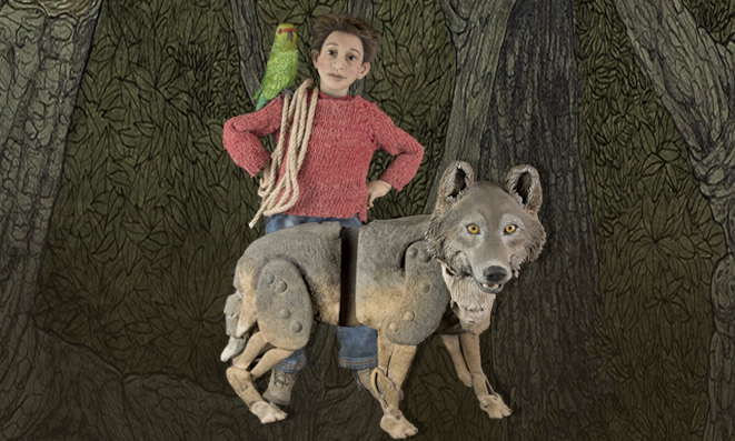 a boy and a wolf puppet