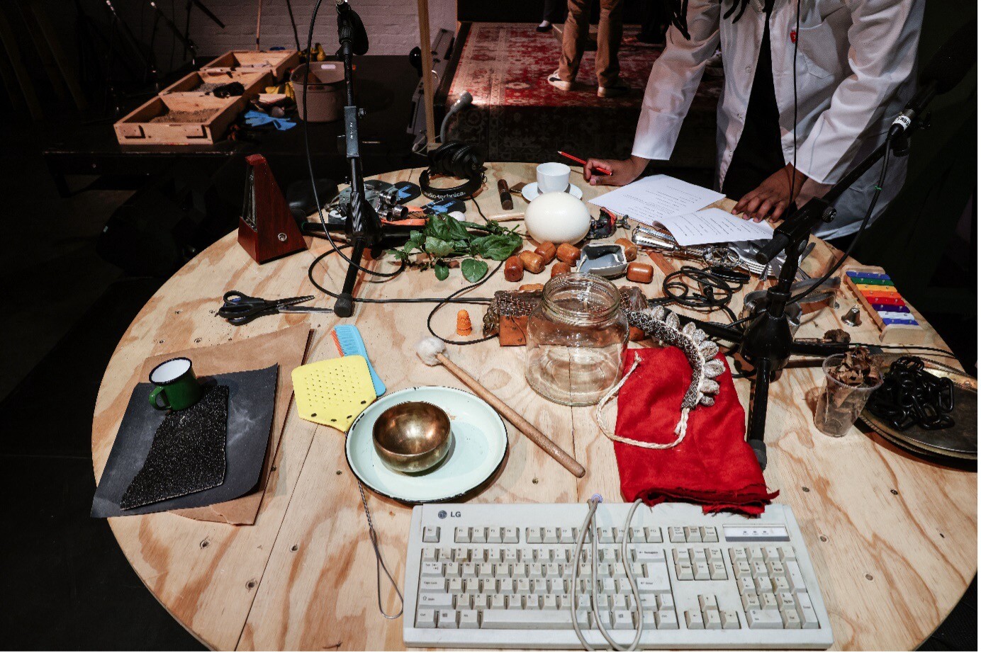 A table full of recording equipment for producing a radio play.